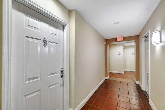 corridor with dark tile patterned floors