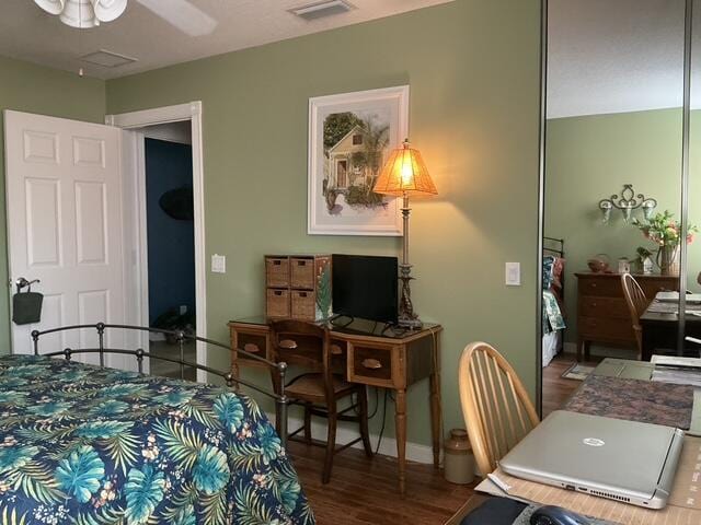 bedroom featuring hardwood / wood-style floors and ceiling fan