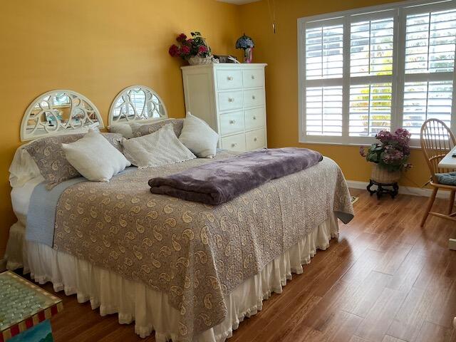 bedroom featuring hardwood / wood-style floors