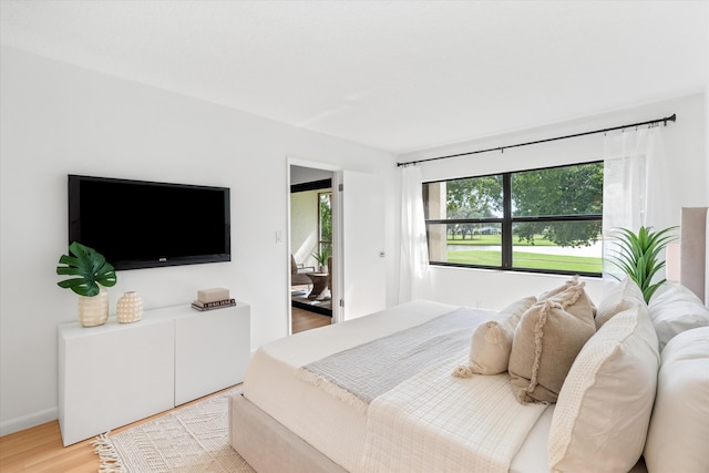 bedroom with light hardwood / wood-style flooring