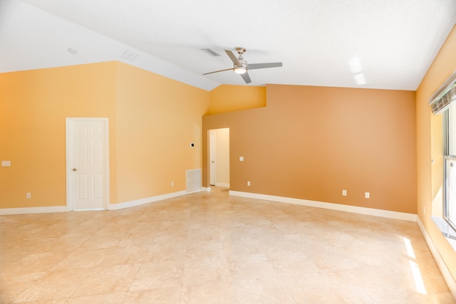 spare room featuring vaulted ceiling and ceiling fan