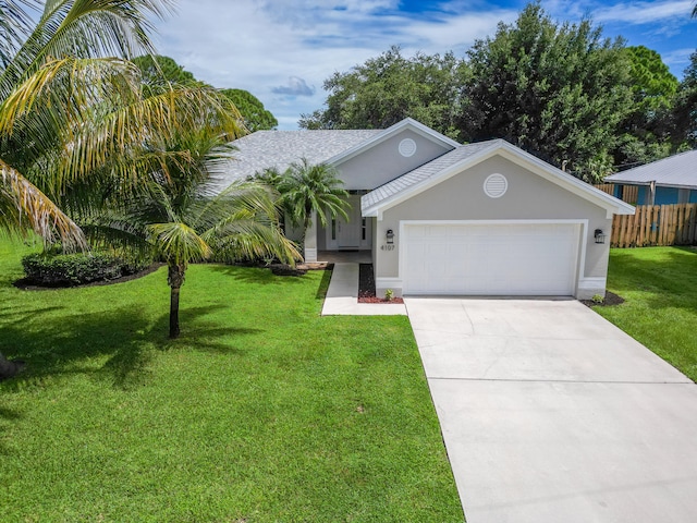 single story home featuring a front lawn and a garage