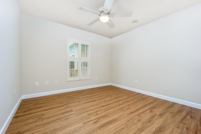 spare room featuring ceiling fan and wood-type flooring