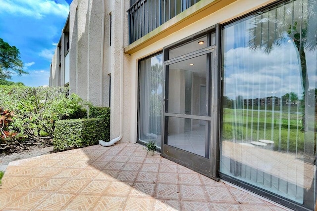 entrance to property with a patio area