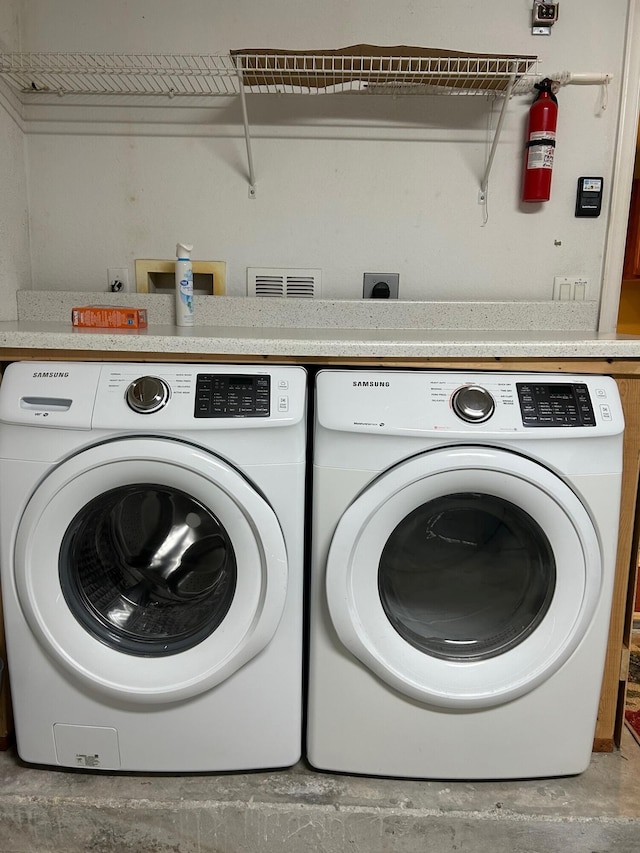 laundry area with washer and dryer