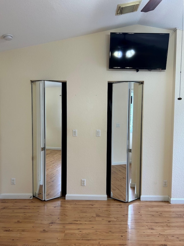 unfurnished bedroom featuring light hardwood / wood-style floors and ceiling fan