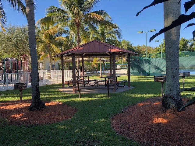 view of community with a lawn and a gazebo