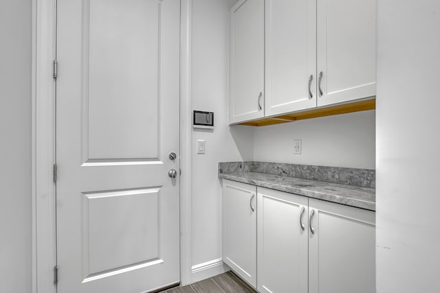 washroom with dark hardwood / wood-style flooring