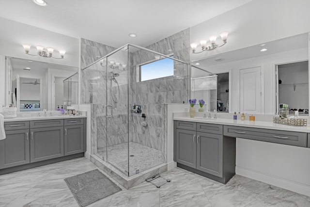 bathroom with an enclosed shower and vanity