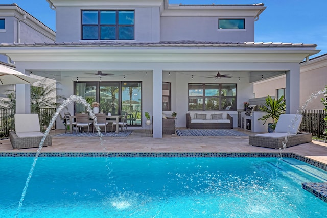 view of swimming pool featuring ceiling fan, outdoor lounge area, and a patio