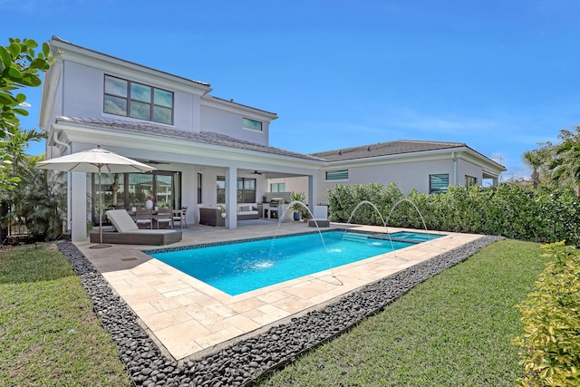 view of pool with pool water feature, a patio area, an outdoor living space, and ceiling fan