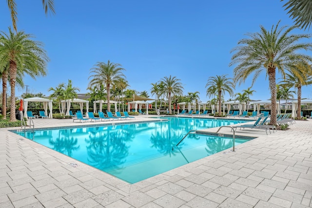 view of swimming pool with a gazebo and a patio