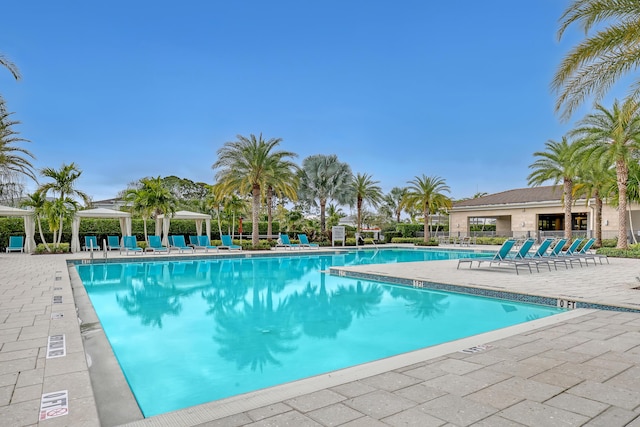 view of swimming pool with a gazebo and a patio