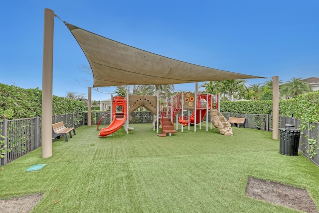 view of playground with a lawn