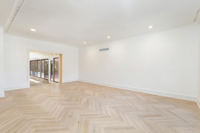 empty room with crown molding and light parquet flooring