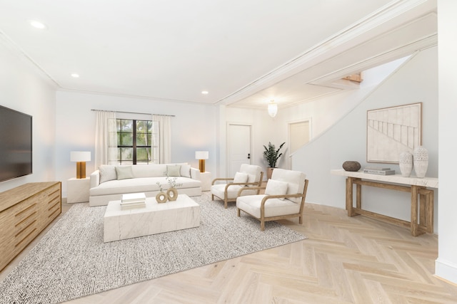 living room with light parquet floors and ornamental molding