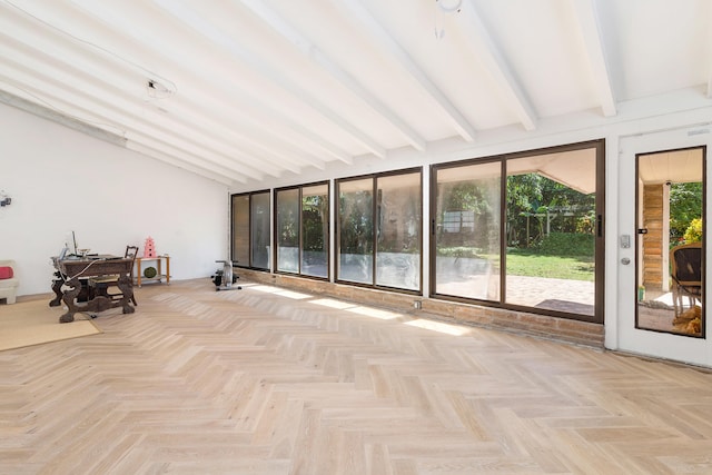 unfurnished sunroom with vaulted ceiling with beams