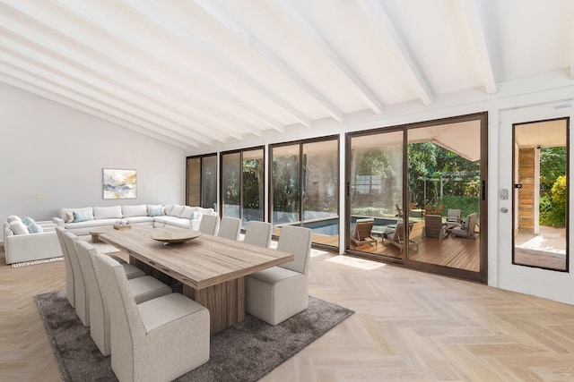 sunroom featuring vaulted ceiling with beams