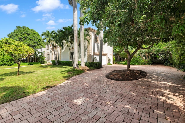 view of front of house featuring a garage and a front yard