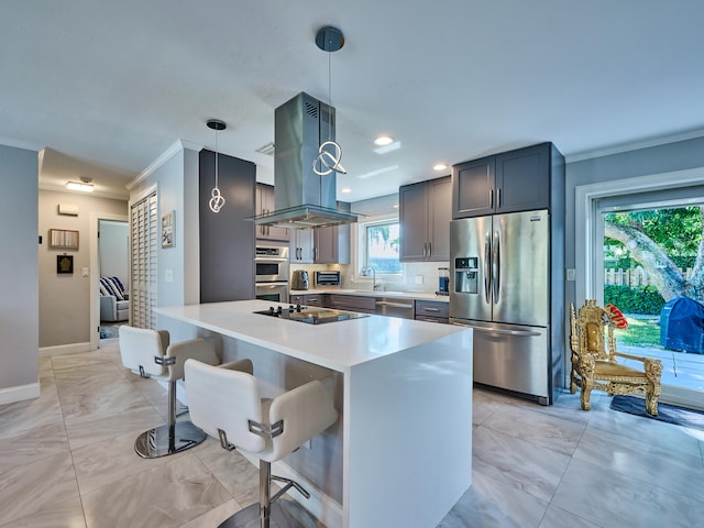 kitchen featuring hanging light fixtures, a breakfast bar area, plenty of natural light, and appliances with stainless steel finishes