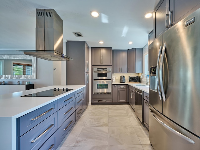 kitchen featuring stainless steel appliances, sink, and island range hood