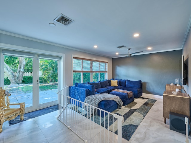 living room with ceiling fan and ornamental molding