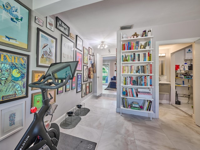 workout area featuring baseboards