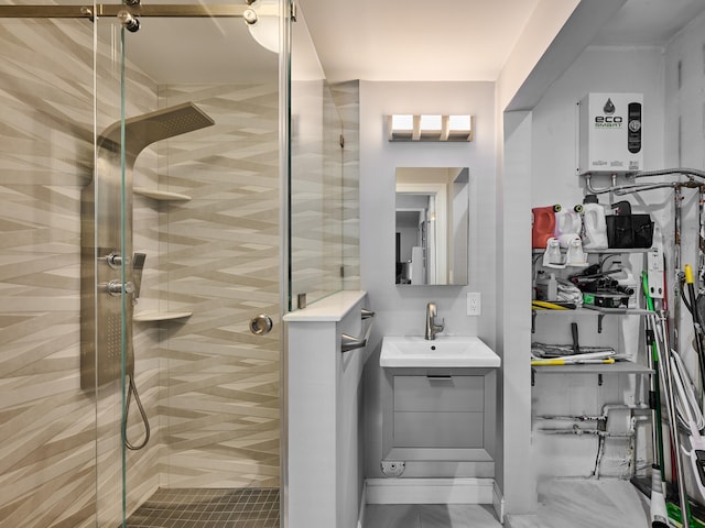 bathroom featuring a shower with door and vanity