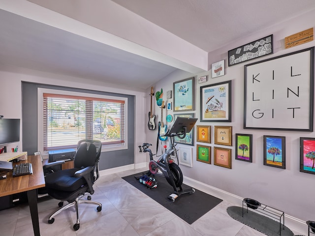 office featuring light tile patterned flooring and lofted ceiling