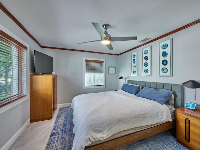 bedroom with multiple windows, ceiling fan, and crown molding