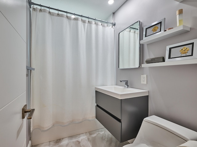 full bathroom with toilet, shower / bath combo, vanity, and tile patterned floors