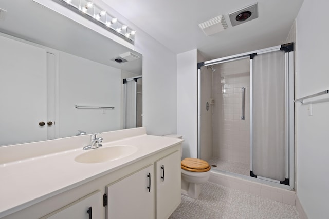 bathroom featuring vanity, toilet, and walk in shower