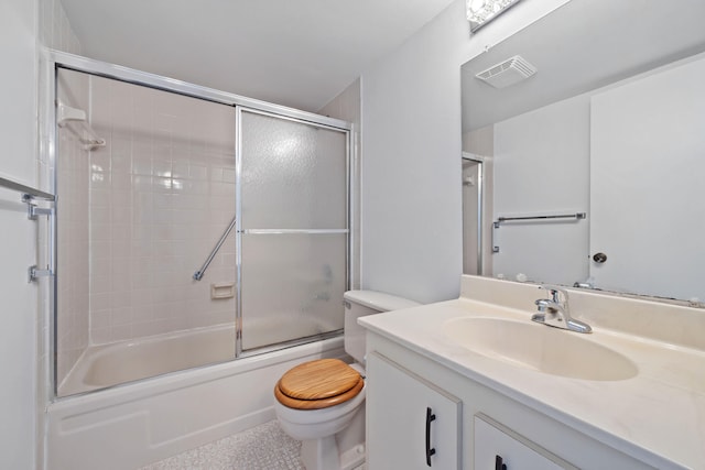 full bathroom with toilet, bath / shower combo with glass door, and vanity