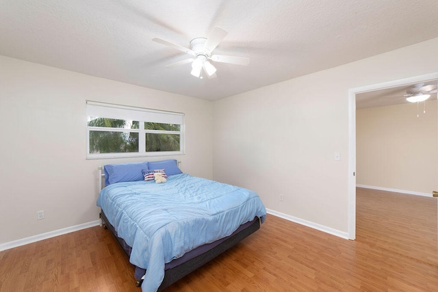 bedroom featuring ceiling fan and hardwood / wood-style floors