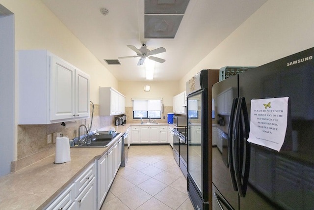 kitchen with sink, white cabinets, backsplash, ceiling fan, and black refrigerator with ice dispenser