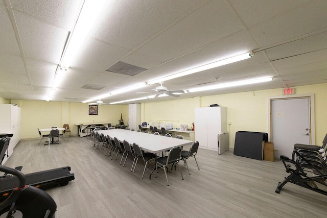 interior space with light hardwood / wood-style floors, ceiling fan, and a paneled ceiling