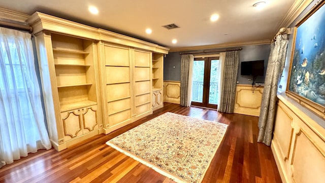 interior space featuring access to outside, french doors, dark hardwood / wood-style floors, and ornamental molding