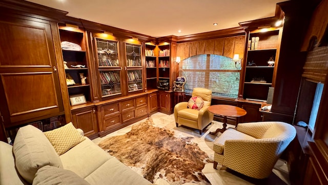 sitting room featuring ornamental molding