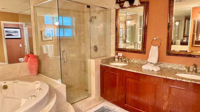 bathroom featuring vanity and independent shower and bath