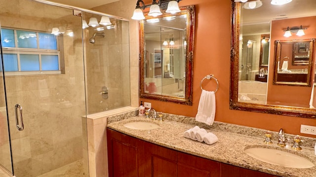 bathroom featuring vanity and an enclosed shower