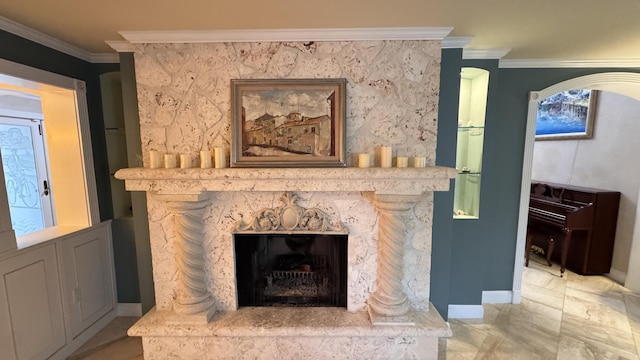 interior details featuring a fireplace and ornamental molding