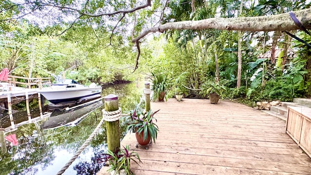 wooden terrace featuring a dock