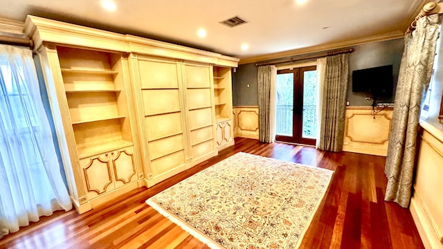 bedroom with access to exterior, french doors, dark hardwood / wood-style floors, and ornamental molding