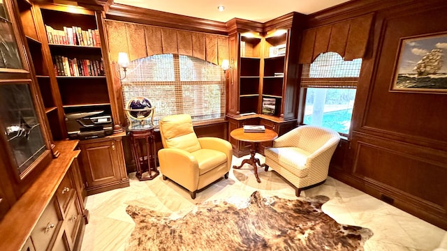 sitting room with ornamental molding