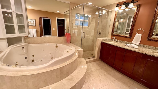 bathroom featuring tile patterned floors, vanity, and separate shower and tub