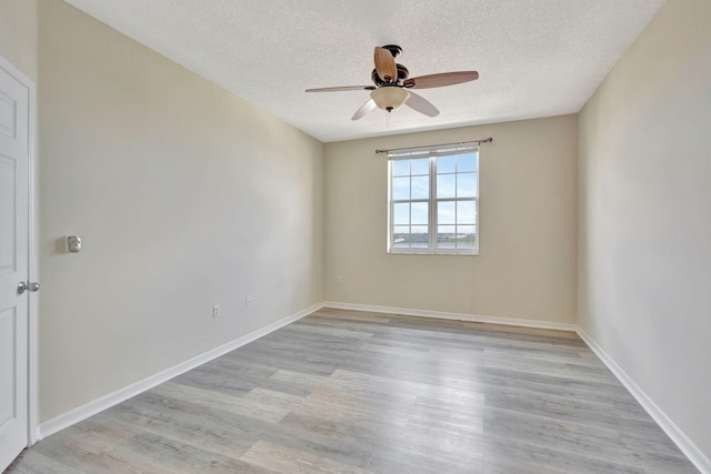 unfurnished room featuring ceiling fan, a textured ceiling, and light hardwood / wood-style floors