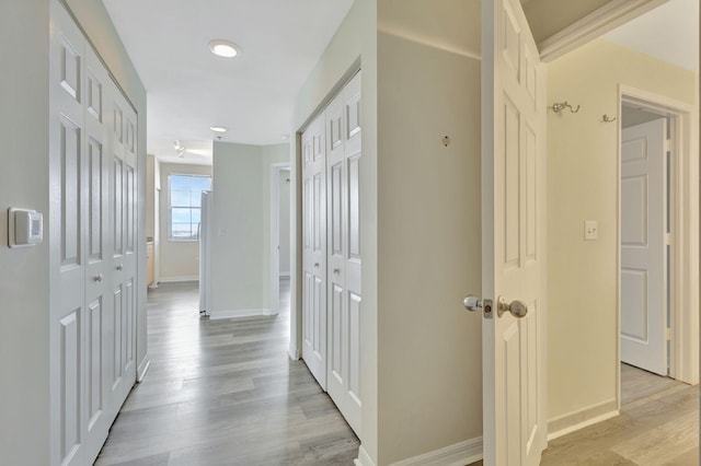 corridor featuring light hardwood / wood-style floors