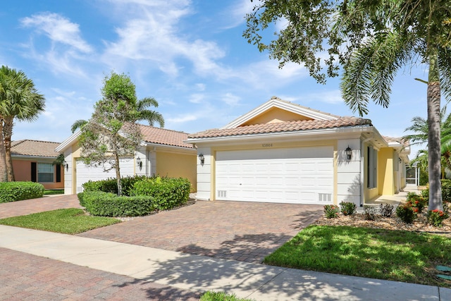 mediterranean / spanish-style home featuring a garage