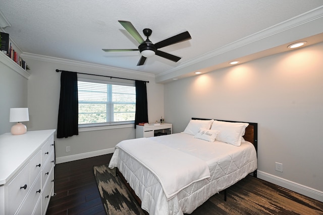 bedroom featuring dark wood-type flooring, crown molding, and ceiling fan