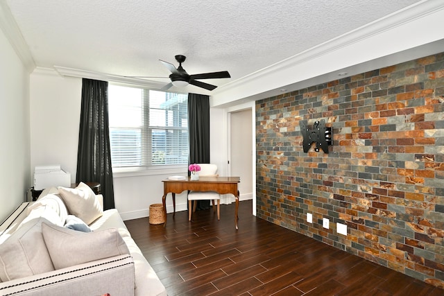 sitting room featuring brick wall, ornamental molding, dark hardwood / wood-style flooring, a textured ceiling, and ceiling fan